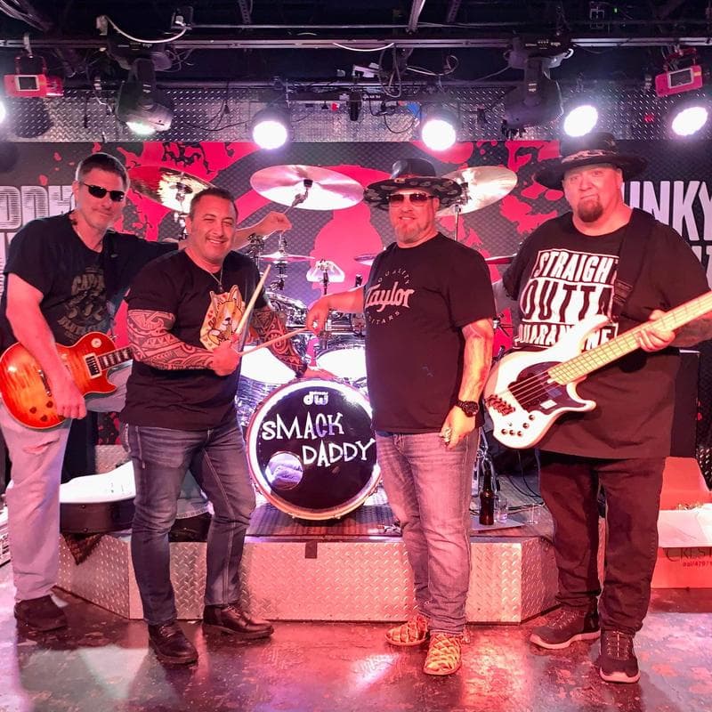 A live band performing on stage at Jack's in North Naples