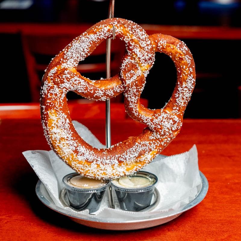 A giant Bavarian pretzel with beer cheese and mustard at Jack's